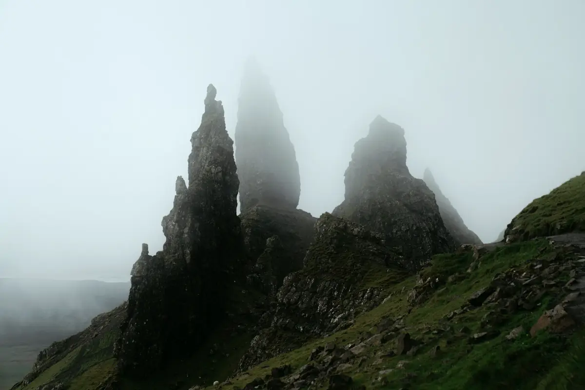 Rock pinnacles standing in fog